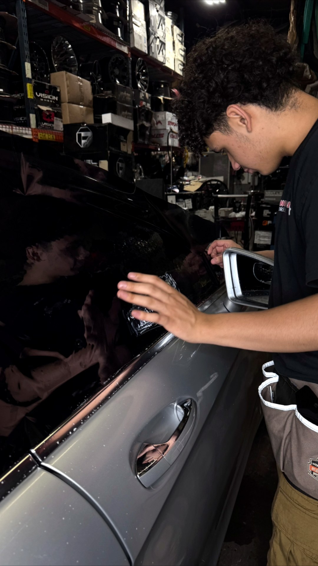 Silver sedan tint install: Film smoothed and set